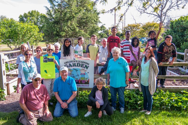 Lewes in Bloom, Lewes Presbyterian Church After School Program volunteers and students gather for a group photo at the end of the program. In front (l-r) are Warren Golde, Fred Phillips, Nancy Palladino and teacher Anna Lockermon. In back, Dianne Stevens, Marilyn Vai, Sandy Asbell, Nancy Phillips, Ann Marie Rooney, Vasti Diaz, Jordynn O'Day, James Webster, Joe Rooney, Keymauri Barnes, Deashaun Lewis, Ja'tara Morris,Piper Price and Jacob Holland. BY DENY HOWETH
